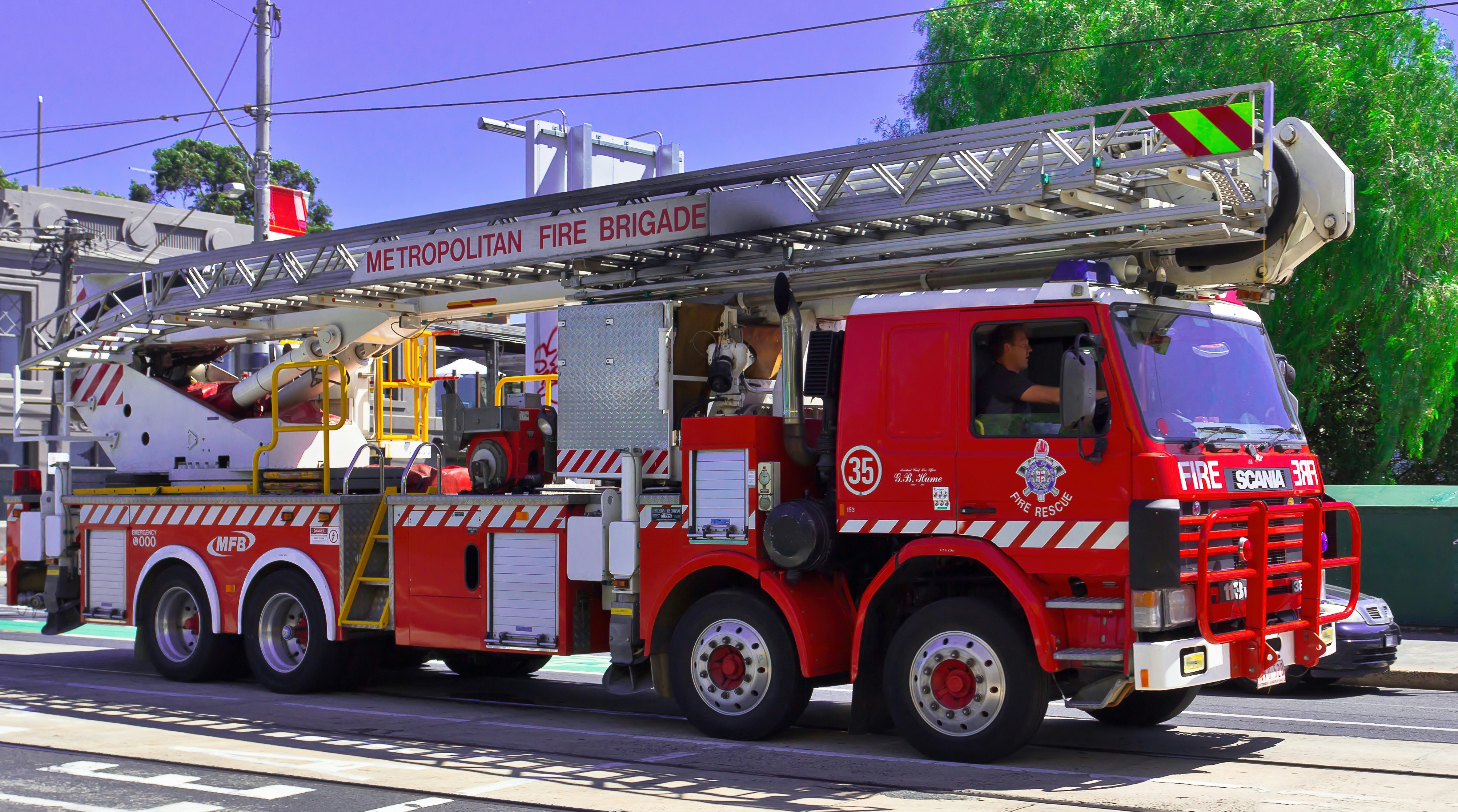 Fire brigade ladder truck on the road
