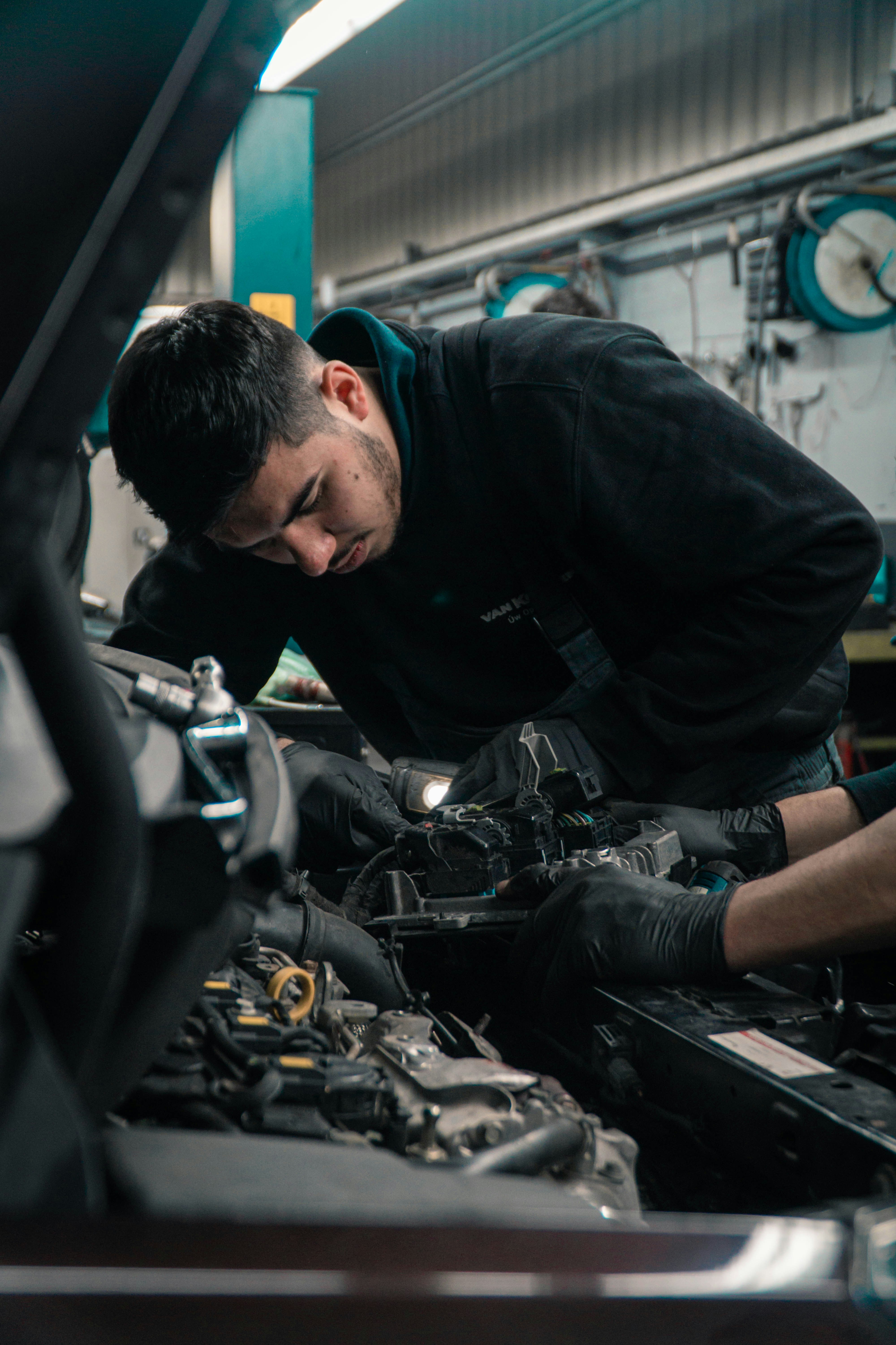 Fleet mechanic working under the hood